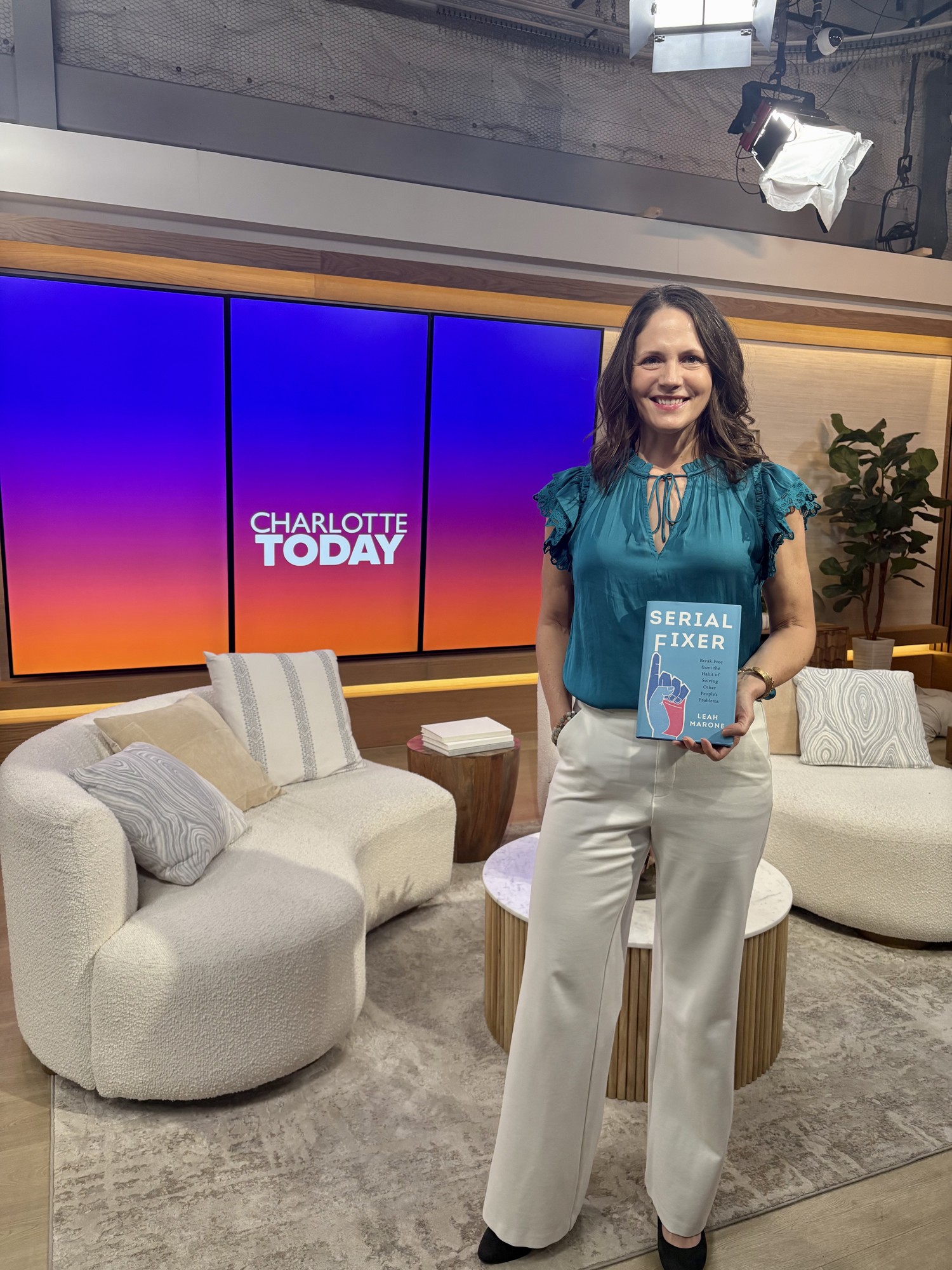 Leah Marone holding Serial Fixer on the Charlotte Today show set
